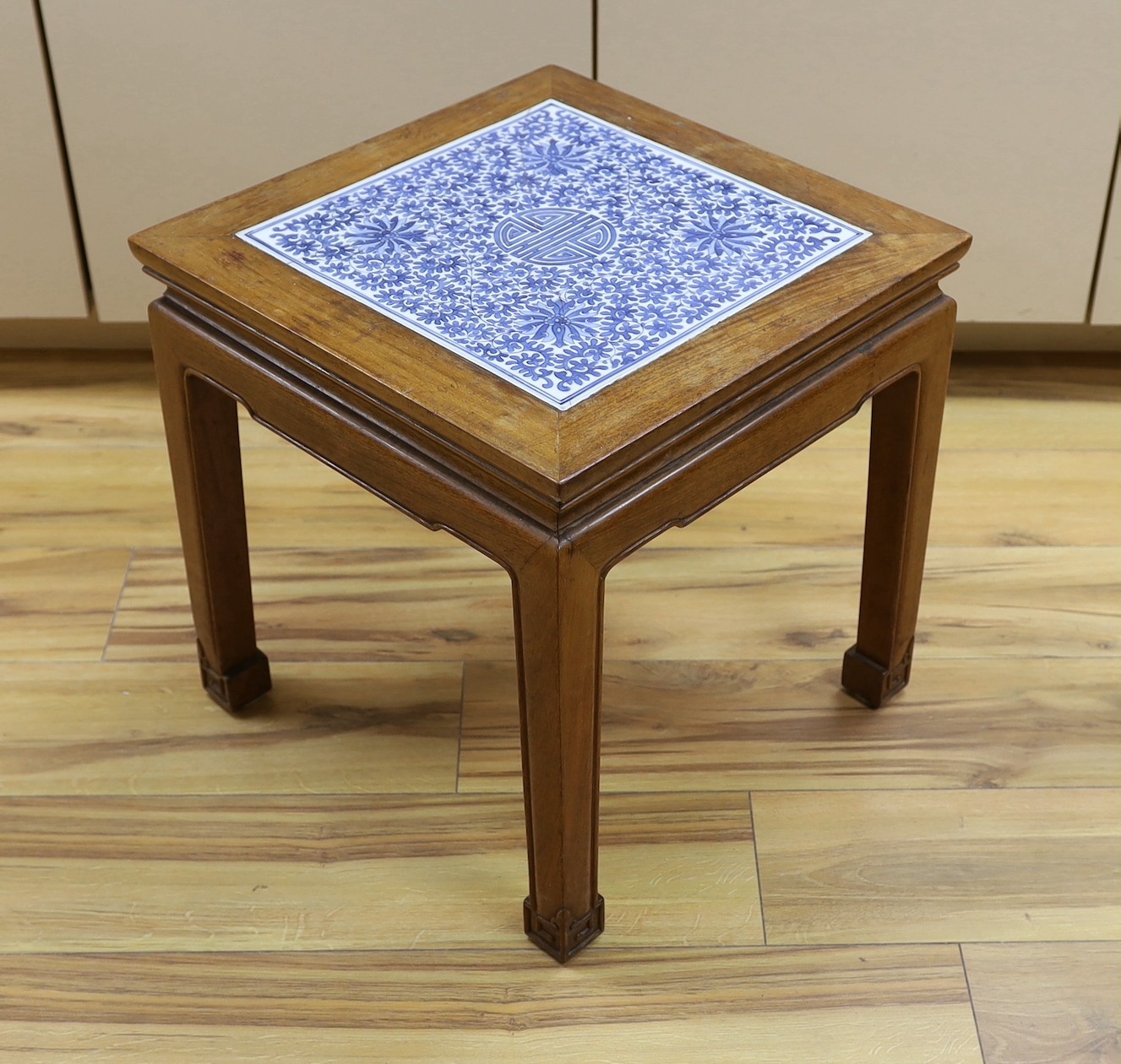 A Chinese hardwood and blue and white porcelain inset table, 42cm square
